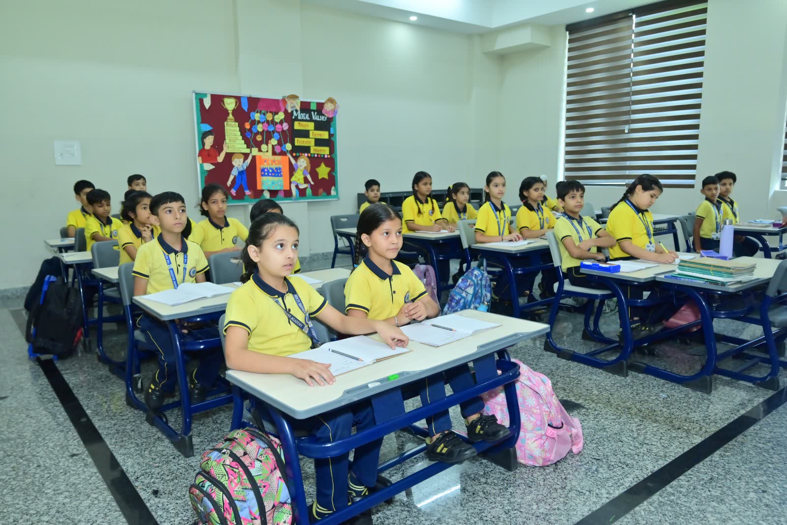 Students seated in an orderly classroom at The Konark Academy